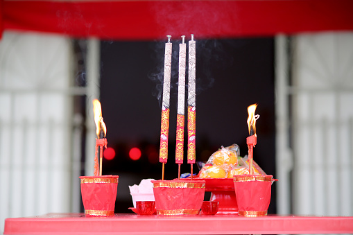 Prayers joss sticks and candles for religious offerings