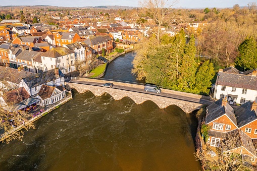 Aerial photo from a drone of the medieval road bridge in Fordingbridge that spans over The River Avon, captured in January 2023.