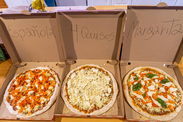 istock three Delicious homemade pizzas, in their boxes 1458738043