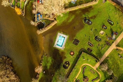 Aerial photo from a drone of Fordingbridge's Recreational Ground, Hampshire, UK captured in January 2023. The River Avon has burst its banks meaning part of the park has become flooded and underwater.