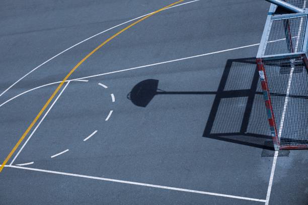 istock shadows on the street basket court 1458739154