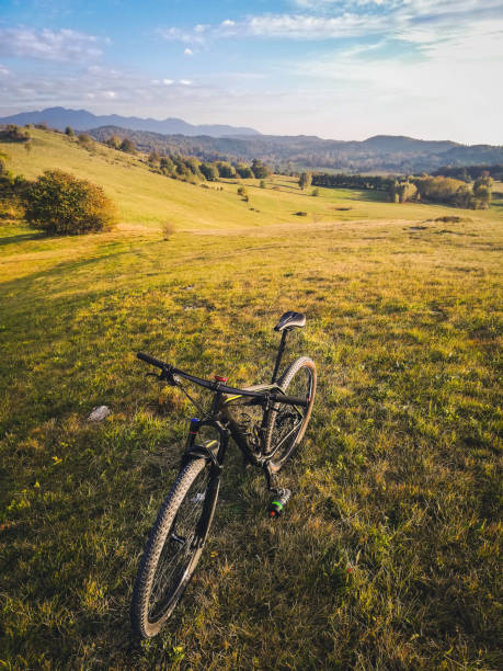 istock Mountain bike on a hill overviewing a beautiful valley 1458739849
