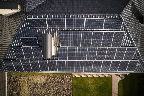 istock Photovoltaic solar panel system on rooftop of house. 1458743227