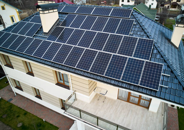 istock Modern residential house with solar panel system on roof. 1458744349