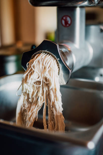 istock Bacon fat through a meat grinder at home for private sausage production 1458747293