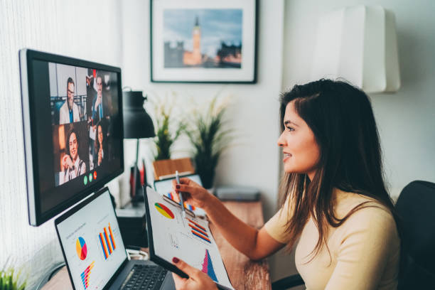 Business meeting on video call during COVID-19 Businesspeople discussing business on virtual staff meeting during pandemic conference call stock pictures, royalty-free photos & images