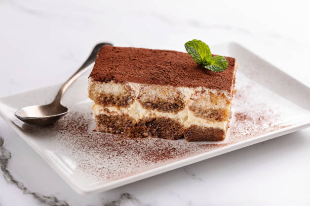 istock Homemade tiramisu on white background 1458748126