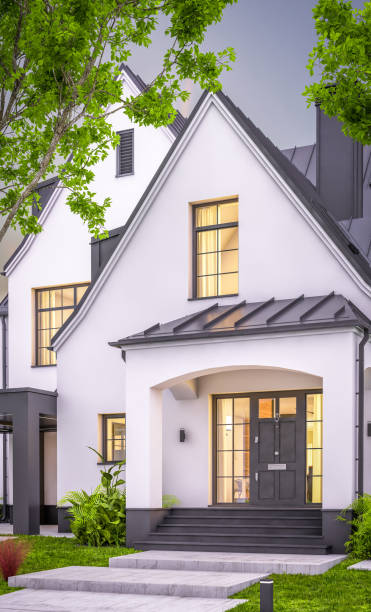 istock 3d rendering of white and black modern Tudor house in evening 1458749188