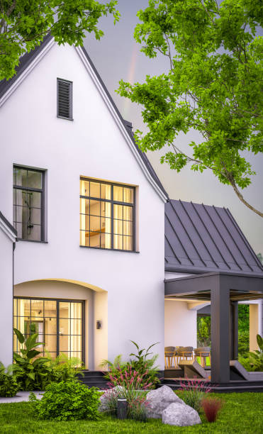 istock 3d rendering of white and black modern Tudor house in evening 1458749238