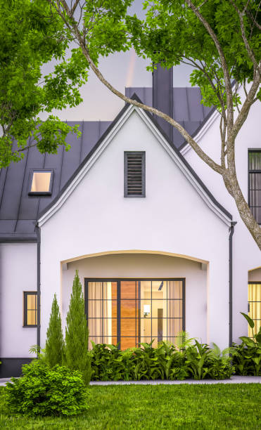 istock 3d rendering of white and black modern Tudor house in evening 1458749248