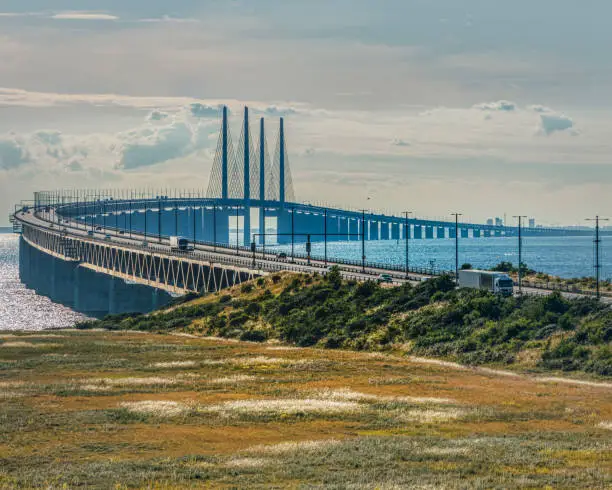 Top view of the Oresundsbron or Oresund Bridge with Copenhagen in the background. Gigantic link between Sweden and Denmark allows nations interconnection via the Oresund channel across the Baltic sea