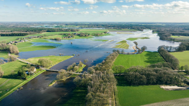 istock Vecht river high water level flooding at the Junne weir drone view 1458756320