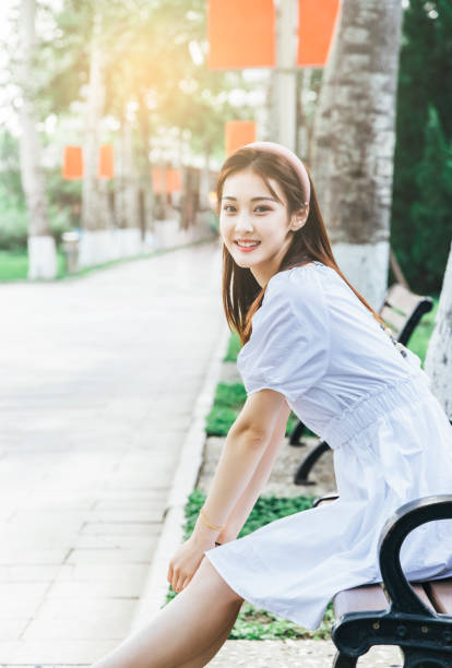 istock Young girl in the park 1458758468