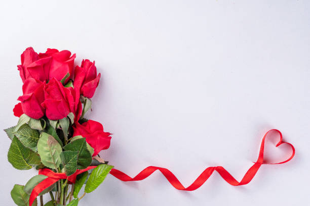 istock Red roses with red ribbon bow 1458758836