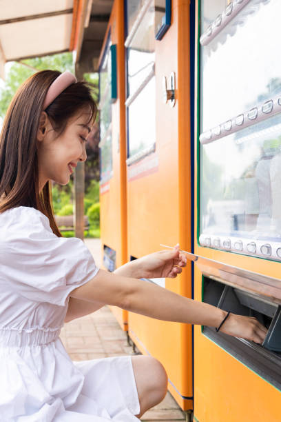istock The girl at the vending machine 1458758838
