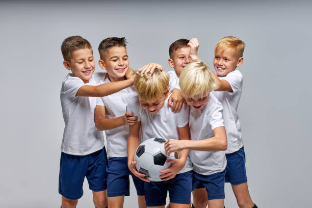 istock boys soccer team celebrating a victory after match 1458761642