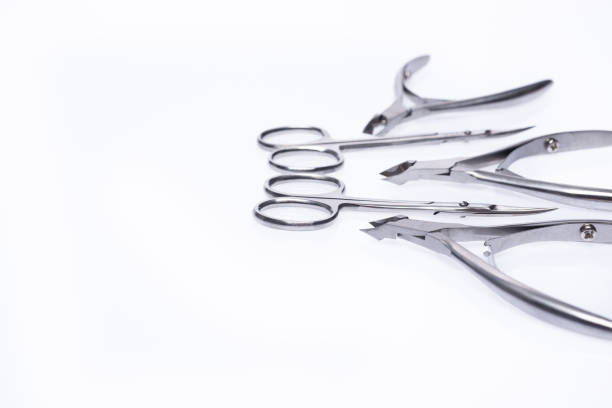 Manicure tool. Set of cuticle nippers and scissors on an isolated white background. Place for text.