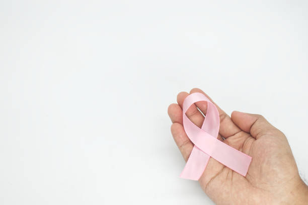 istock hand hold pink ribbon  on white background 1458777349
