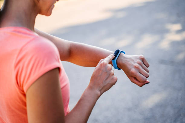 istock Young Woman Checking Pulse On Her Smartwatch After Exercising 1458780259