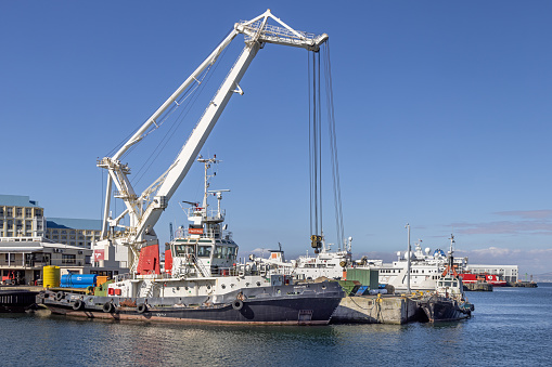 Floating crane and a tugboat