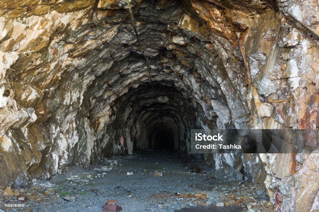 Old mine in Alaska Old gold mine tunnel entrance around Salmon Glacier, Hyder, Alaska Alaska - US State Stock Photo