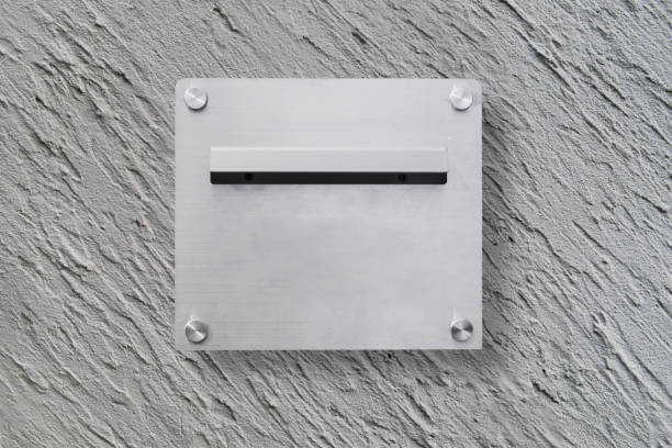 istock Modern aluminium mailbox for receive letter, newspaper and document that installed on grey concrete wall 1458784539