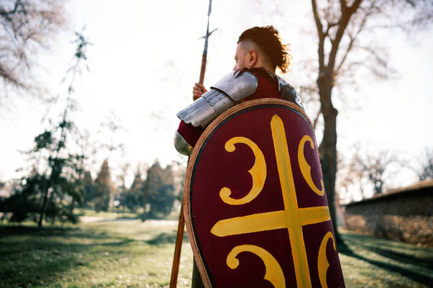 istock Male medieval warrior with spear and shield 1458784663