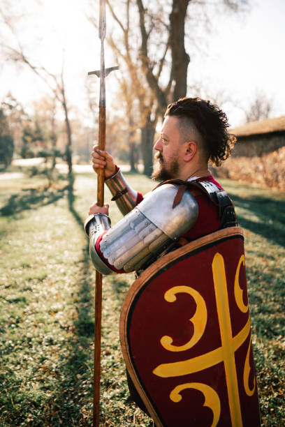 istock Male medieval warrior with spear and shield 1458784785