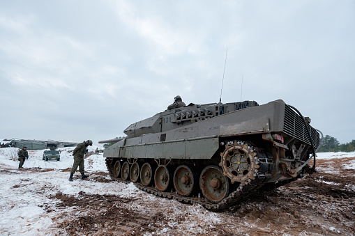 ADAZI, LATVIA, FEBRUARY 2018 - Leopard 2 Tank at NATO forces exercises. Spanish army conducted training exercise with Leopard 2A6 Main Battle Tanks and armored fighting vehicles ASCOD Pizarro