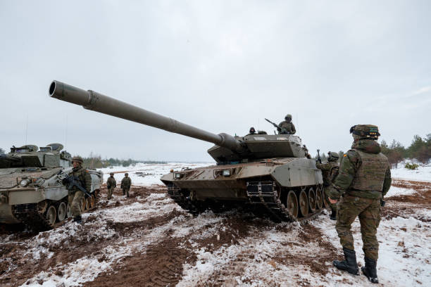 Leopard 2 Tank at NATO forces exercises ADAZI, LATVIA, FEBRUARY 2018 - Leopard 2 Tank at NATO forces exercises. Spanish army conducted training exercise with Leopard 2A6 Main Battle Tanks and armored fighting vehicles ASCOD Pizarro nato stock pictures, royalty-free photos & images