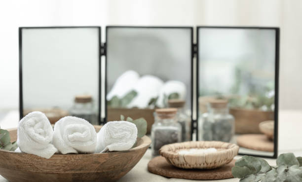 istock Spa composition with towels in a wooden plate on a blurred background. 1458788704