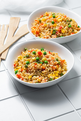 Bulgur with vegetables in a white plate close-up