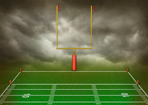 Football red zone view of end zone with dark clouds in the background. 3D Illustration