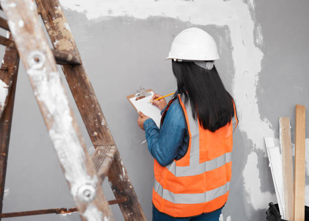istock A construction supervisor checks renovation project with checklist on clipboard 1458793590