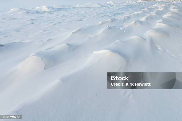 Patterns In The Snow On Top Of The Ice On Grand Traverse Bay Near Traverse City Michigan Stock Photo - Download Image Now