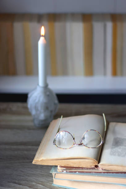 istock Candle, Books, Glasses and Bookshelf 1458797123