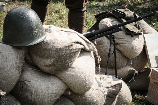 Historical reenactment of I world war machine gun position covered with sandbags