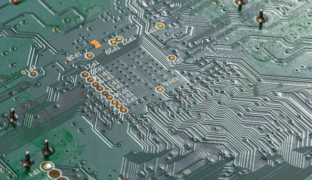 istock Macro Close up of printed wiring on PC circuit board 1458797918