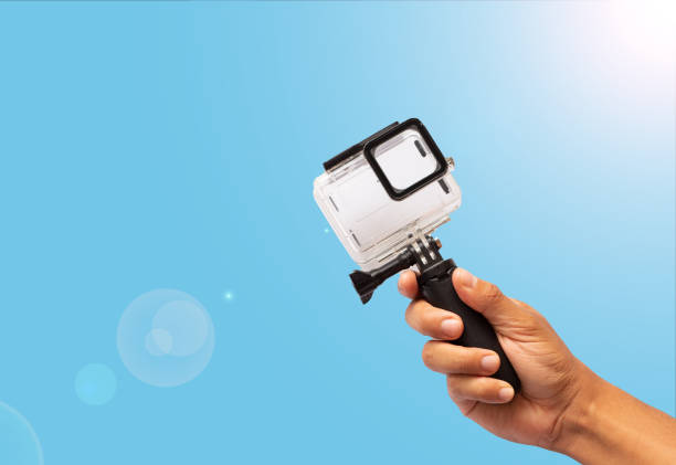 istock a man's hand holding a gopro 1458800676