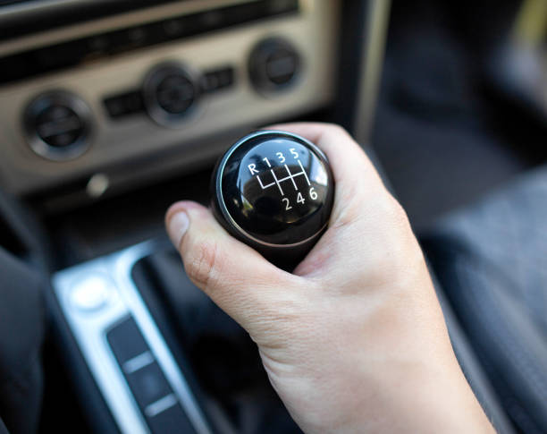 istock Switching a mechanical 6-speed gearbox in a car, close-up. Transmission 1458800918