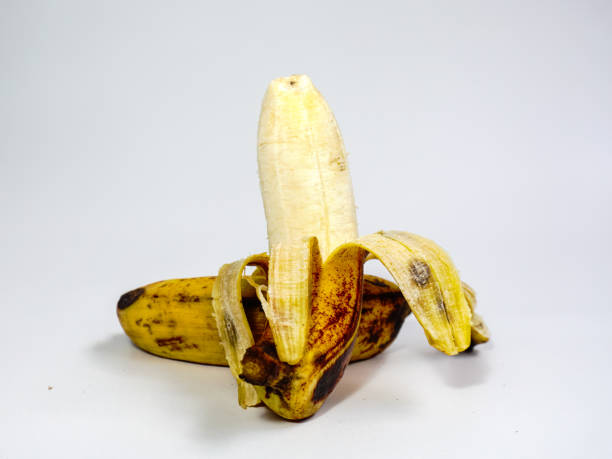 istock Banana fruit peeled isolated on white background. Over ripe bananas. 1458803038