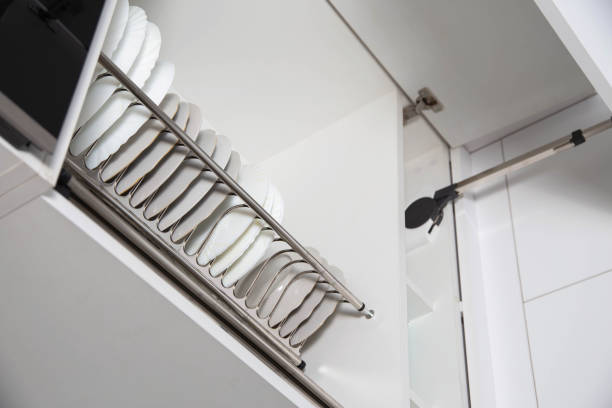istock Storage of clean dishes in a separate kitchen section with a lifting mechanism. Modern kitchens 1458803266