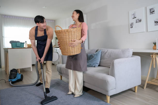 Happy young Asian couple cleaning home together, healthy lifestyle concept Happy young Asian couple cleaning home together, healthy lifestyle concept asian couple doing household chored stock pictures, royalty-free photos & images