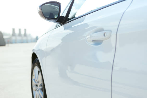 istock A white small car parked in a parking lot 1458809476