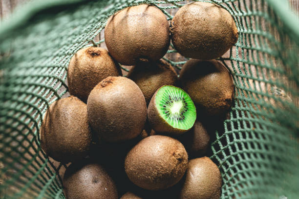 Kiwi fruits in eco bag, top view, close -up. stock photo