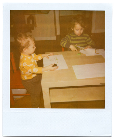 Brother and sister doing arts and crafts at home instant print