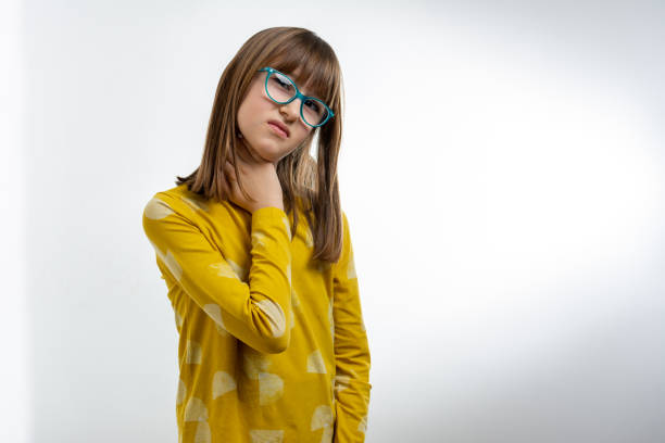 beautiful little girl looking up and thinking. she nice-looking attractive lovely sweet curious cheerful cheery smart clever girl creating new idea solution fantasize copy space isolated