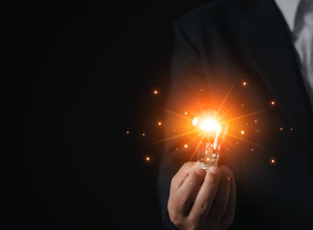 istock Businessman hand hold light bulb for good idea. brainstorming creative idea. Inspiration. 1458814176