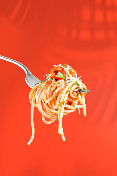 istock Spaghetti pasta in tomato sauce on a fork. Clipping path. Full depth of field. 1458816082