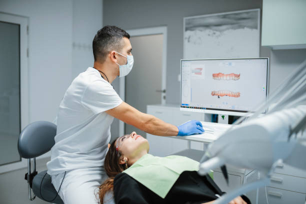 istock Scanning patient's teeth with a modern 3D dental scanner. 1458817574